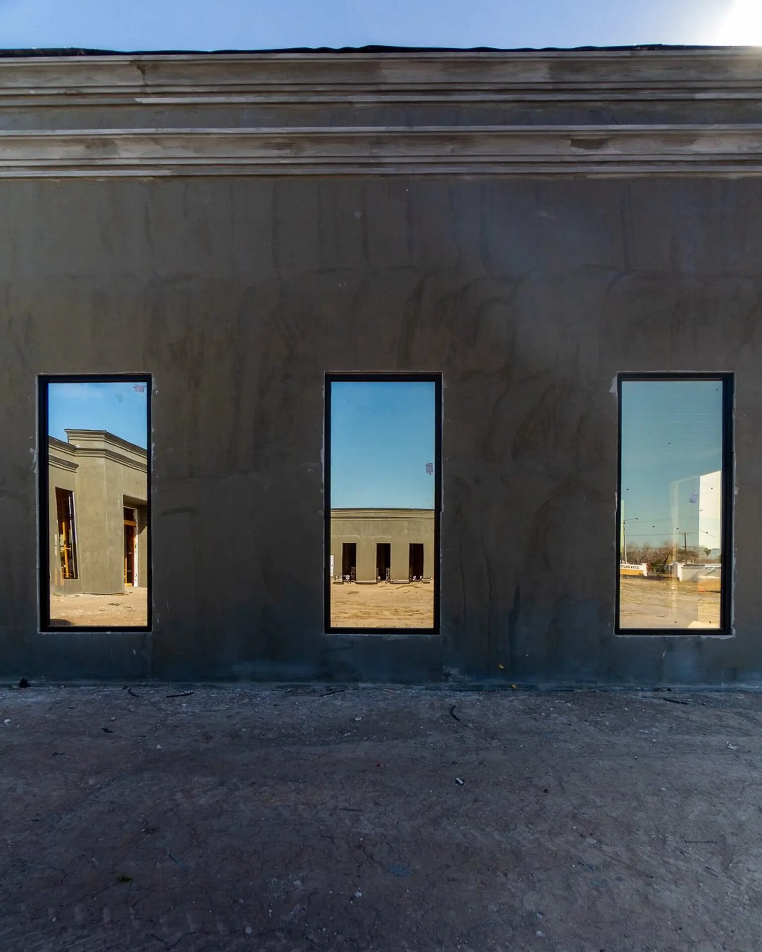 Architectural window system with three full-height tempered glass panels