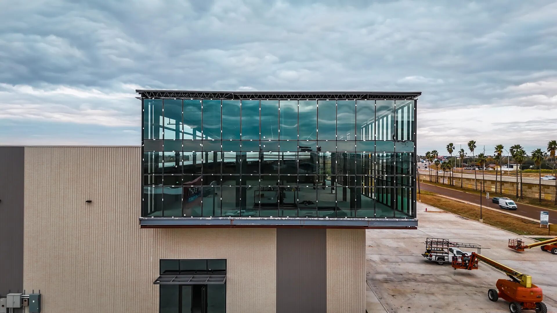 Large-format commercial glass curtain wall installation in the Rio Grande Valley